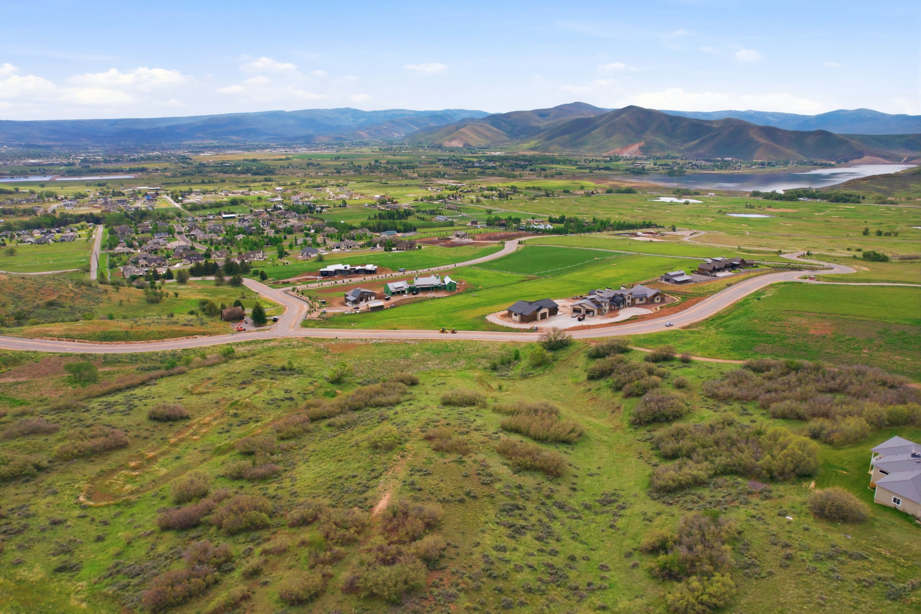Expansive undeveloped land featuring rolling hills and established greenery