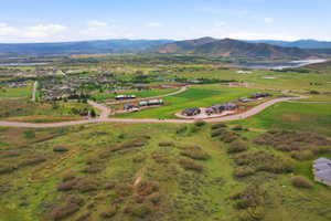 Expansive undeveloped land featuring rolling hills and established greenery