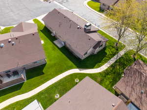 Brown shingle roofing with a prominent chimney structure