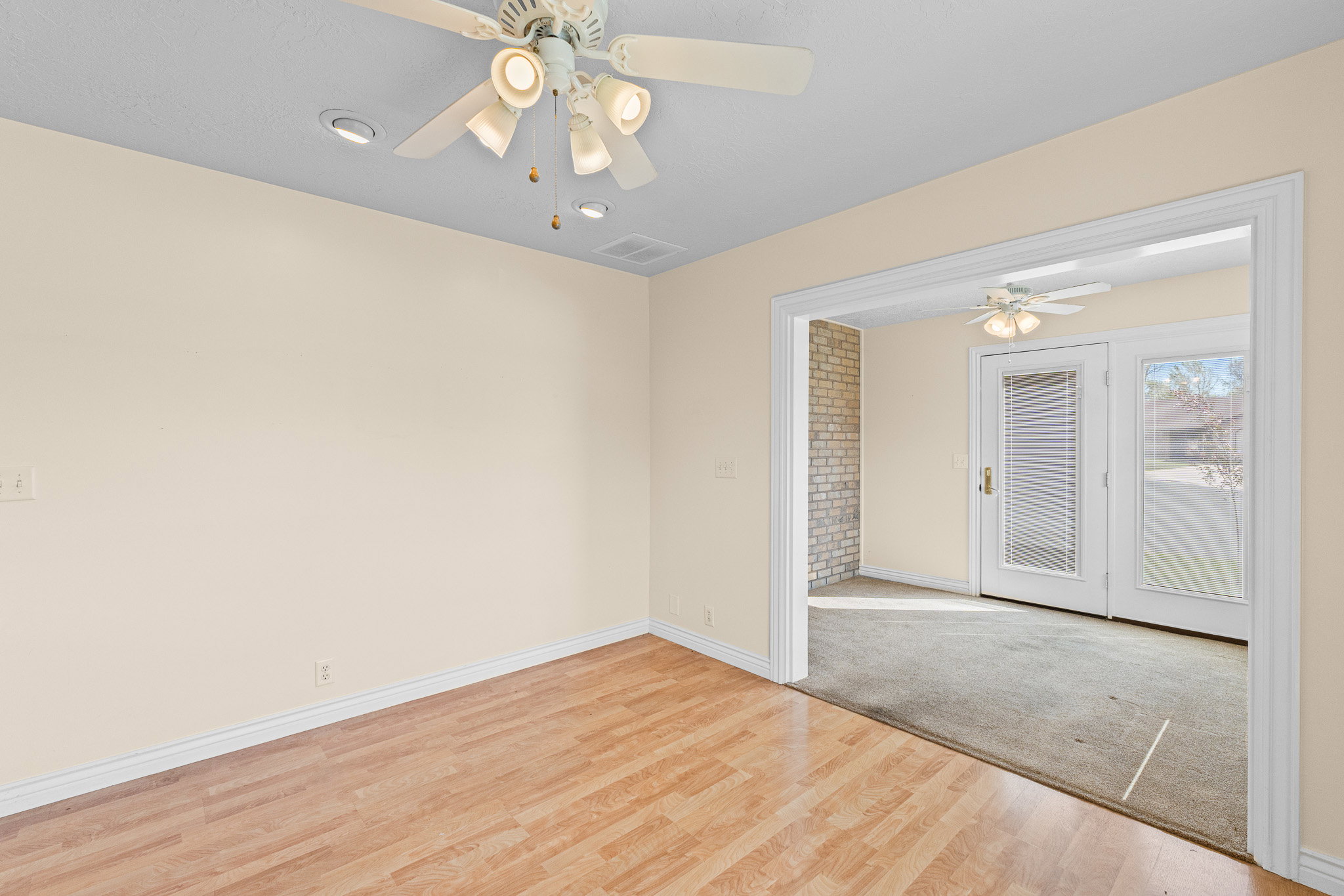 Room featuring wood-finish flooring, recessed lighting, and a ceiling fan