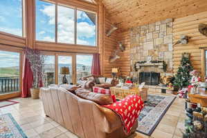 Expansive living area featuring soaring ceilings and panoramic windows
