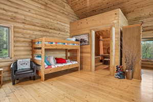 Expansive wood-finish flooring extending into an adjacent room