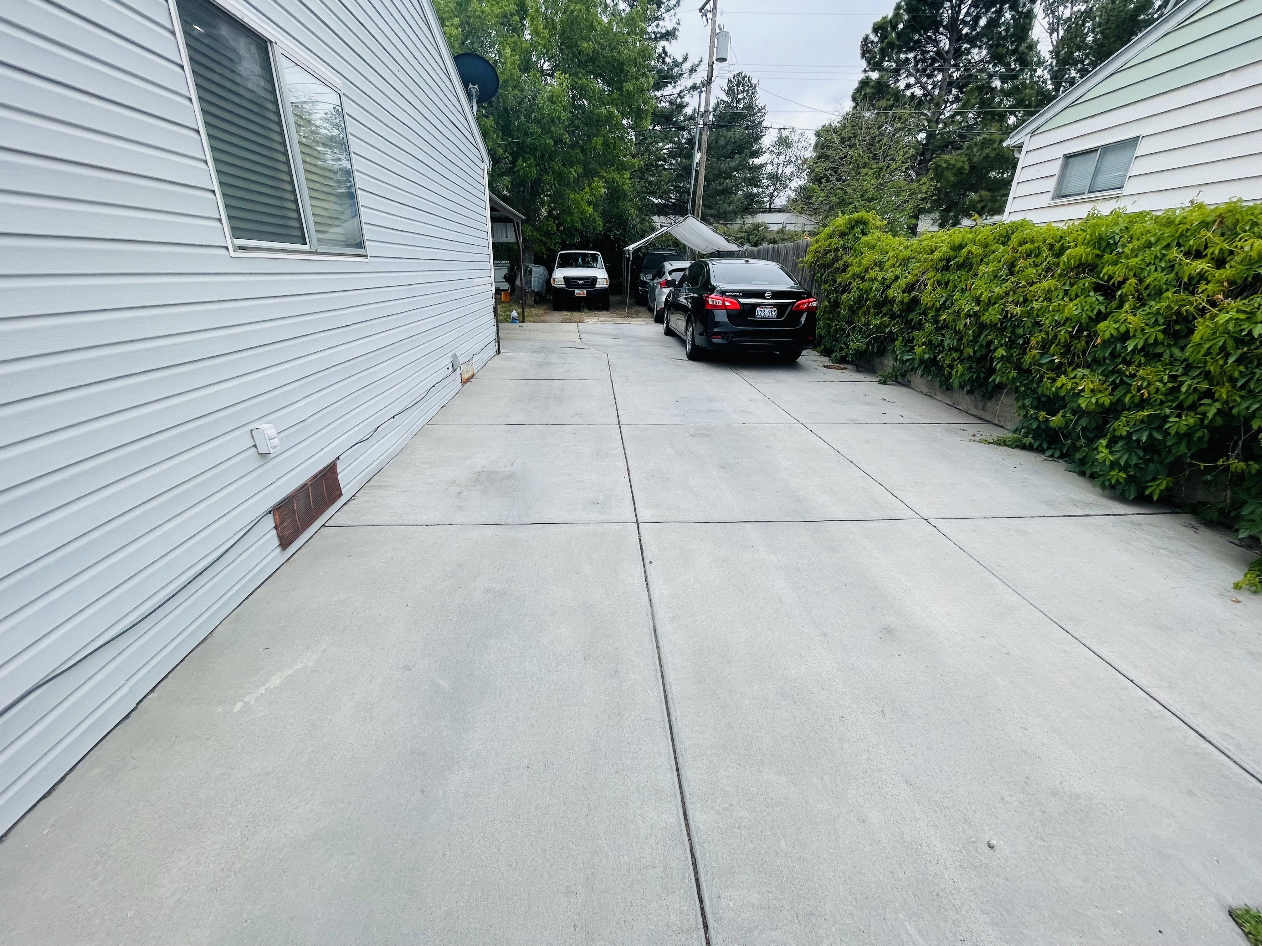 Long concrete driveway with a durable surface