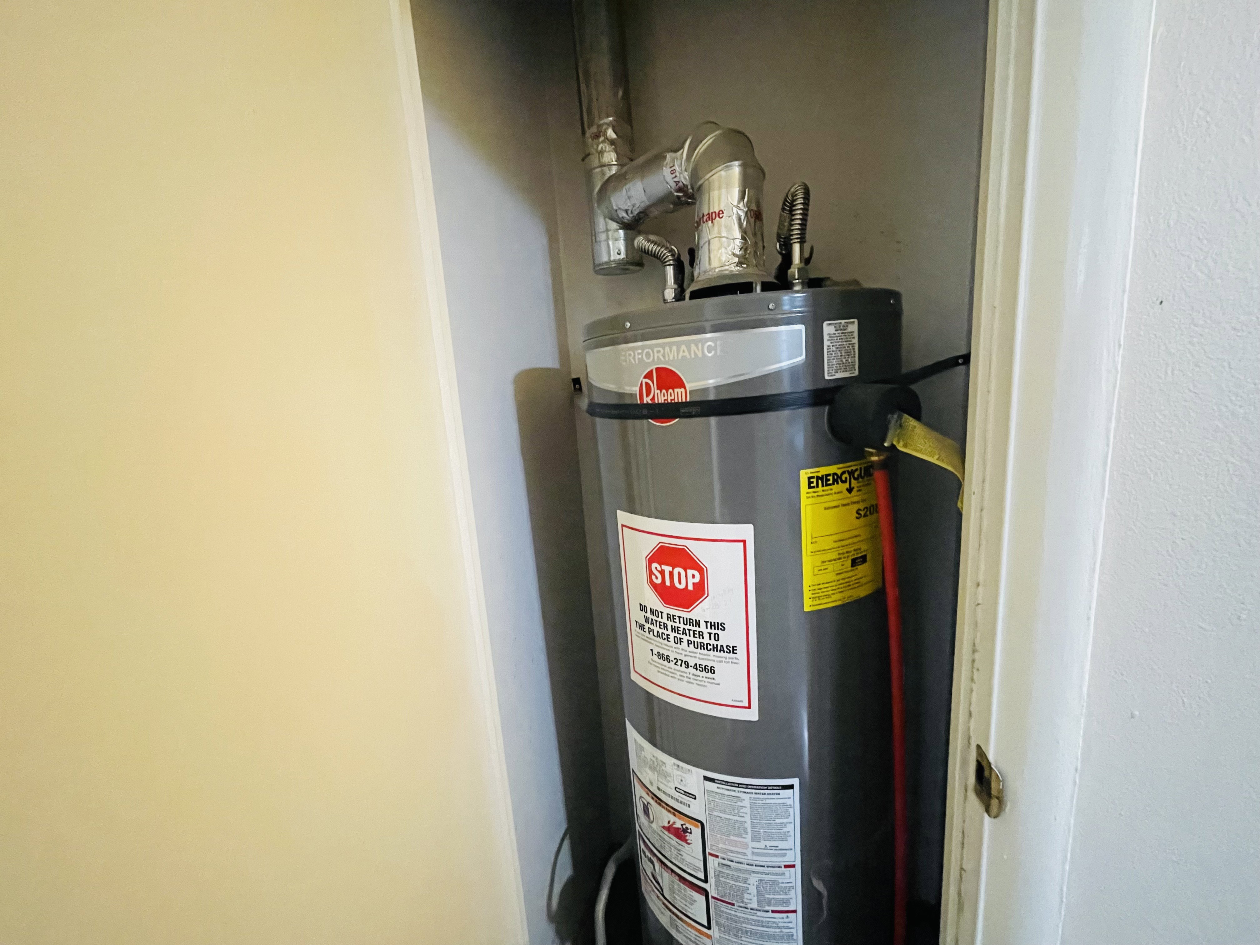 Water heater installed within a dedicated utility closet