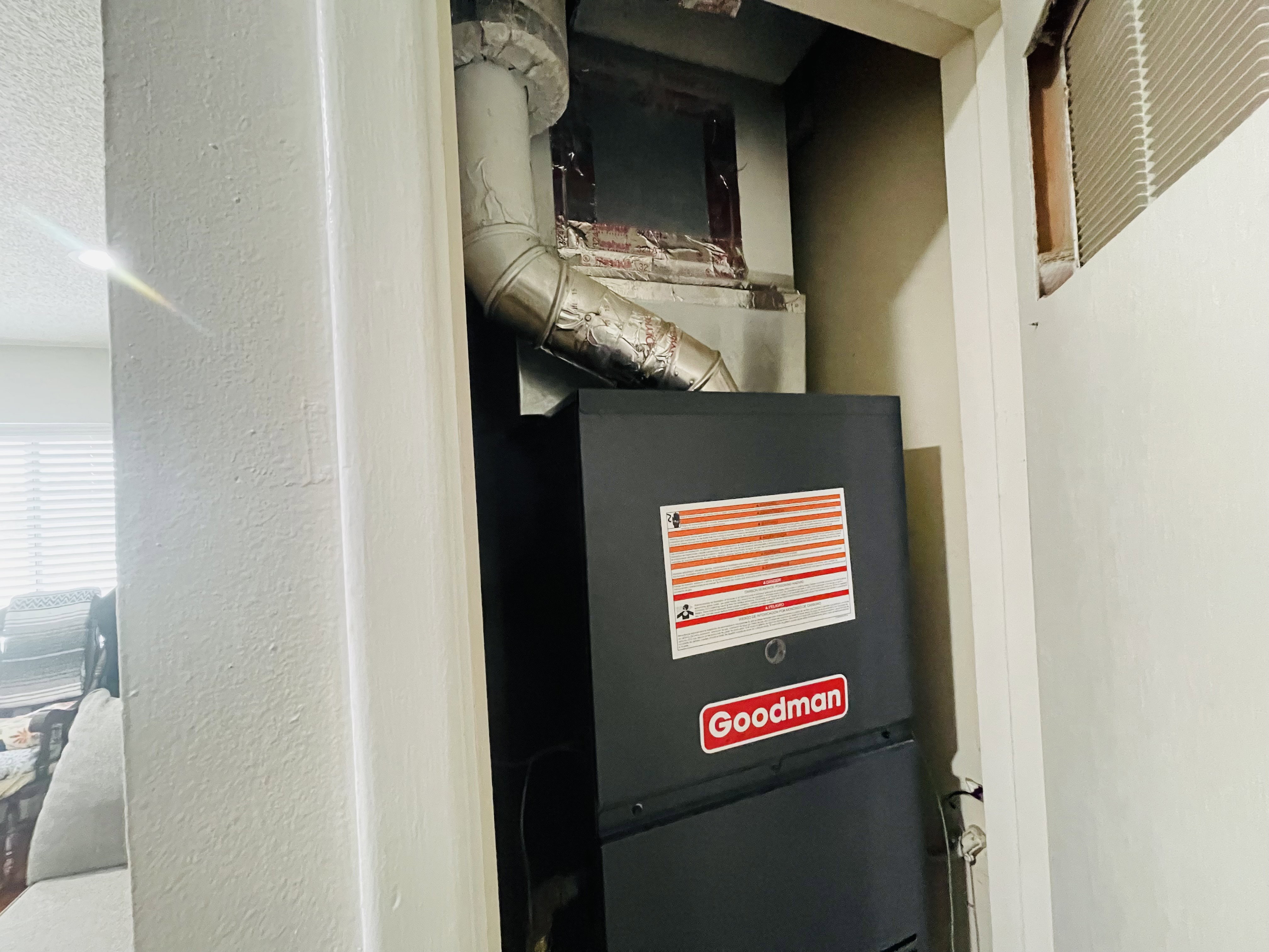 Goodman brand HVAC unit with visible ductwork