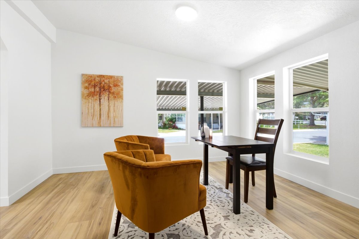Bright interior space featuring light wood-finish flooring and white walls