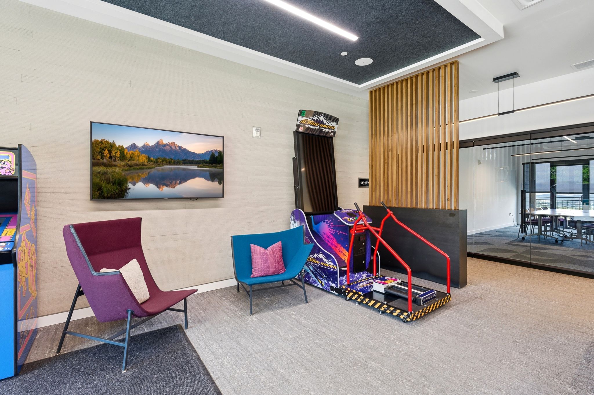Modern interior space featuring textured wall finishes and a wood slat partition
