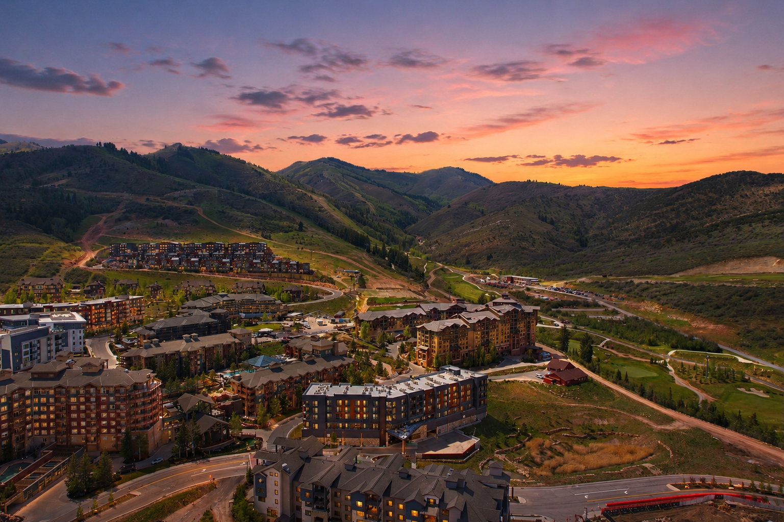 Expansive mountain landscape featuring numerous multi-story residential buildings