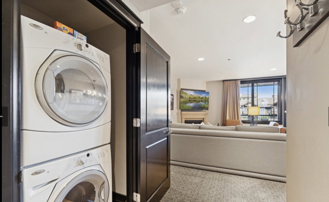 Front-loading stackable washer and dryer within a dedicated closet