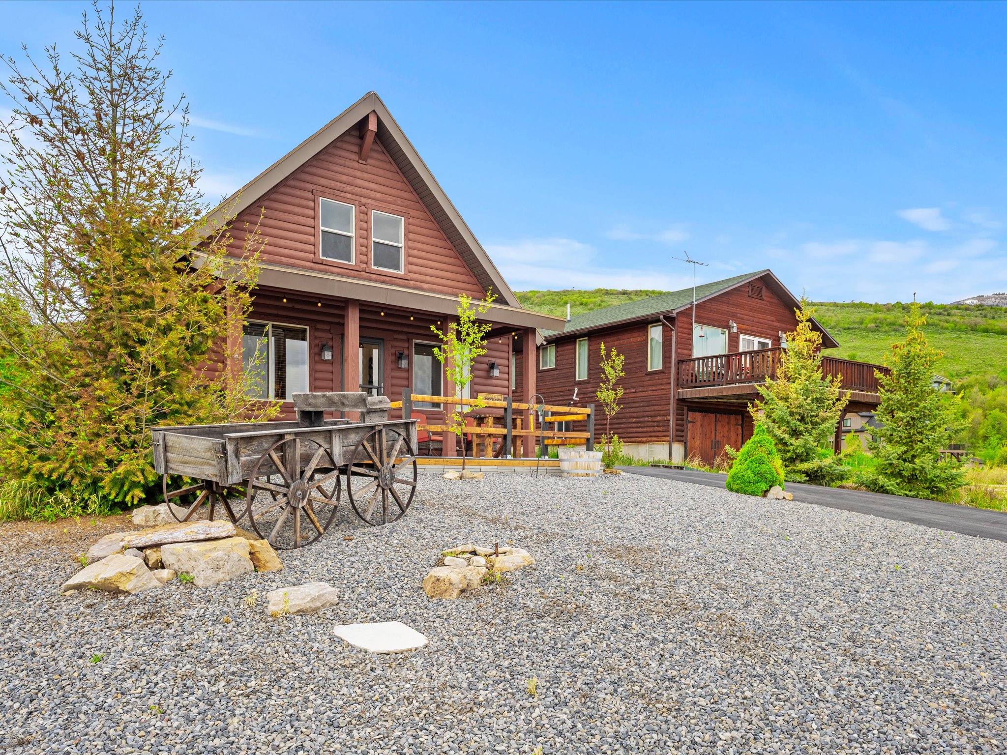 Log cabin-style exterior with a covered porch and gabled roofline
