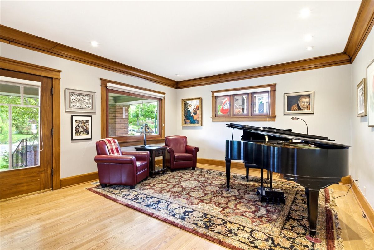 Room featuring light wood-finish flooring and a decorative area rug