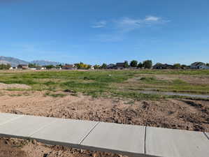 Level lot with a newly poured sidewalk
