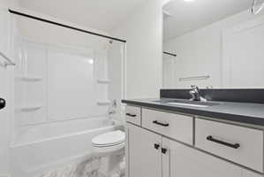 Bathroom featuring a white tub/shower combination with integrated shelving