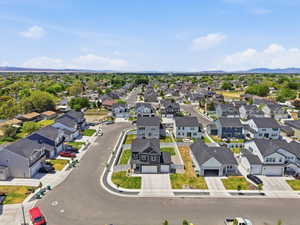 Contemporary residential development featuring multiple two-story homes with dark shingle roofs