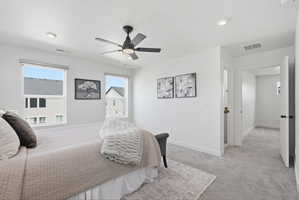 Interior space featuring a contemporary ceiling fan with integrated lighting, recessed lighting, and two windows allowing natural light