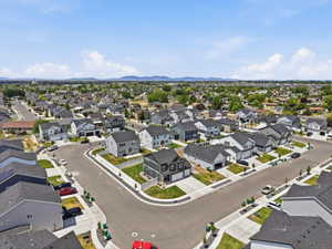 Expansive aerial showcasing a contemporary residential development with numerous single-family homes