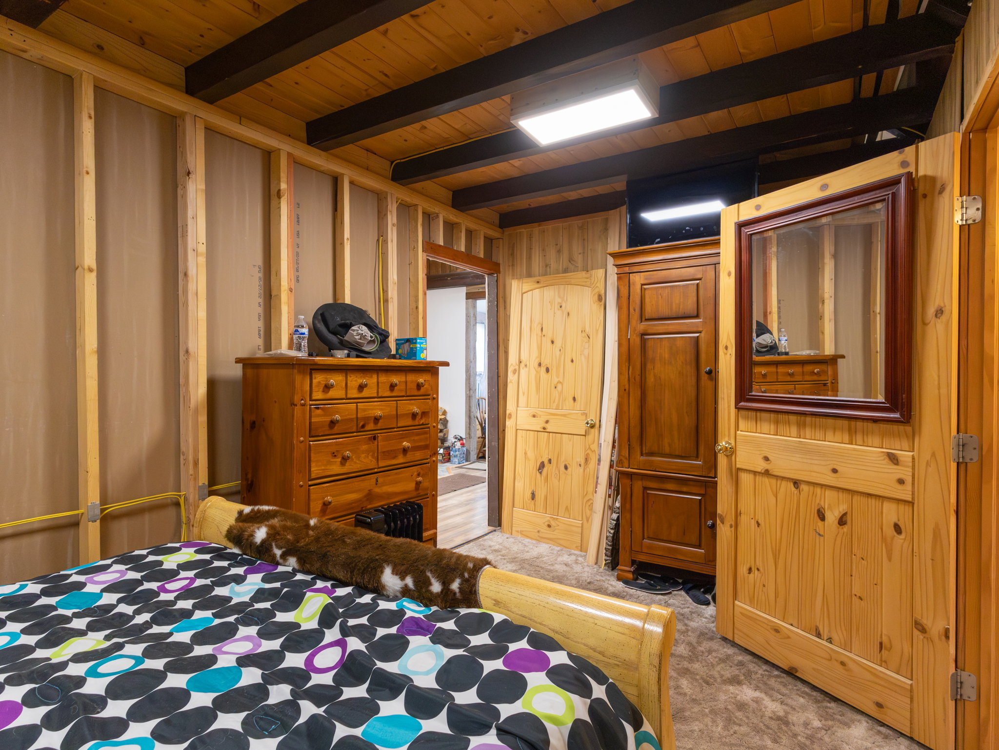 Wood-paneled ceiling with dark exposed beams