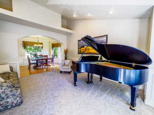 Spacious Formal LIving Room into Formal Dining Room with Arched Entry