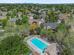 Private Neighborhood Swimming Pool with Plenty of Lounge Chairs, a Covered Club House Picnic Area, & Bathrooms