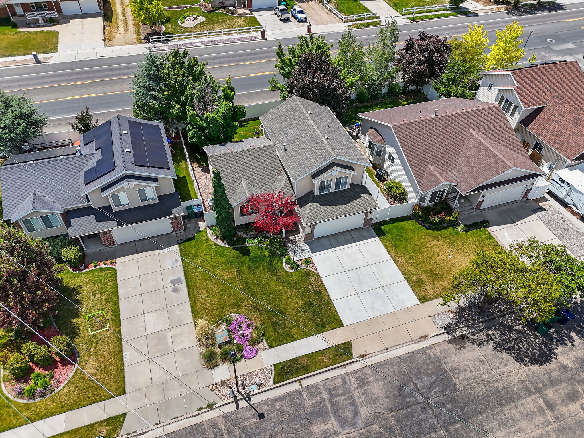 Aerial perspective highlighting a residential street with multiple properties