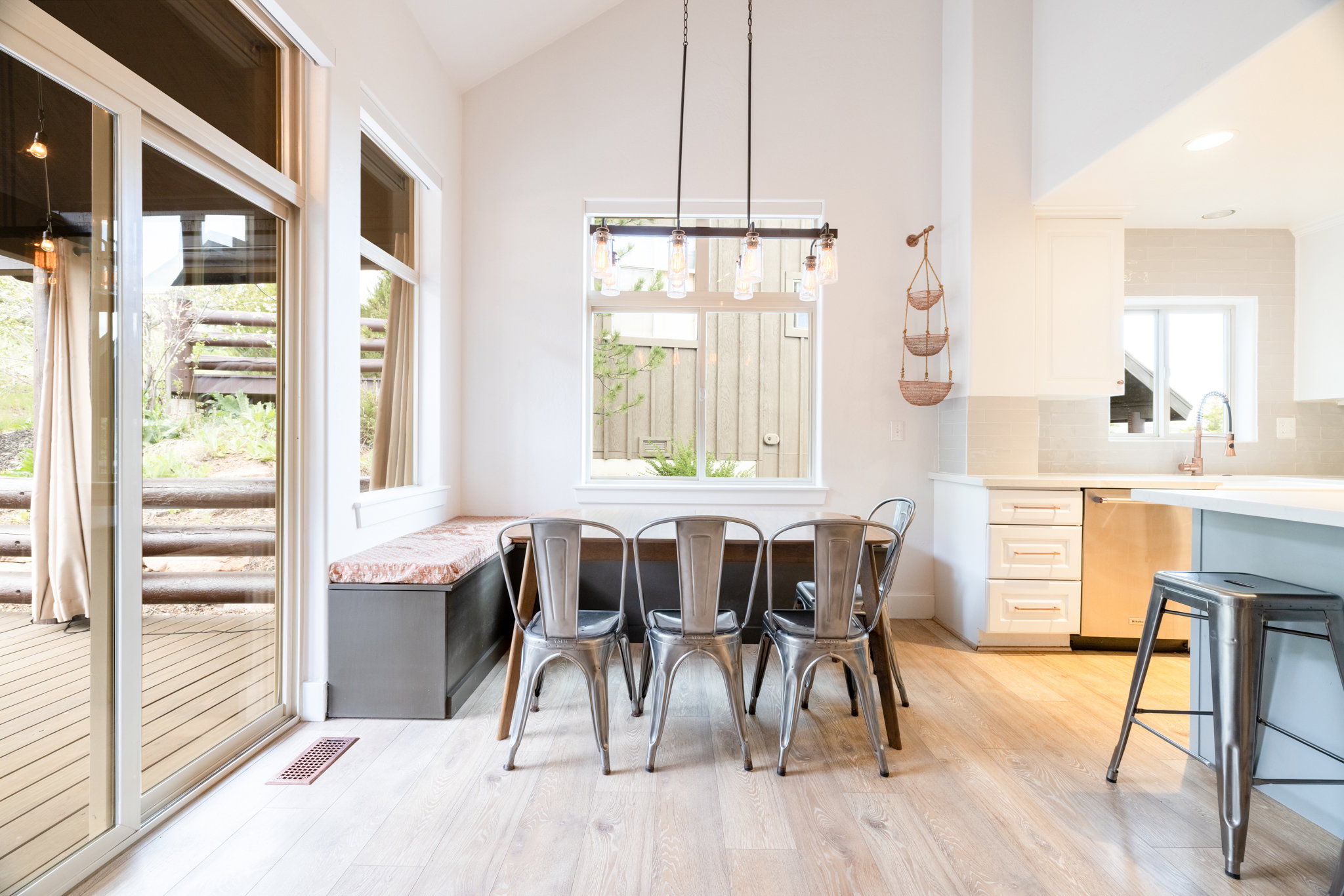 Vaulted ceilings complement the light wood-finish flooring