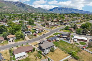 Aerial perspective showcasing the residential neighborhood with a backdrop of prominent mountains