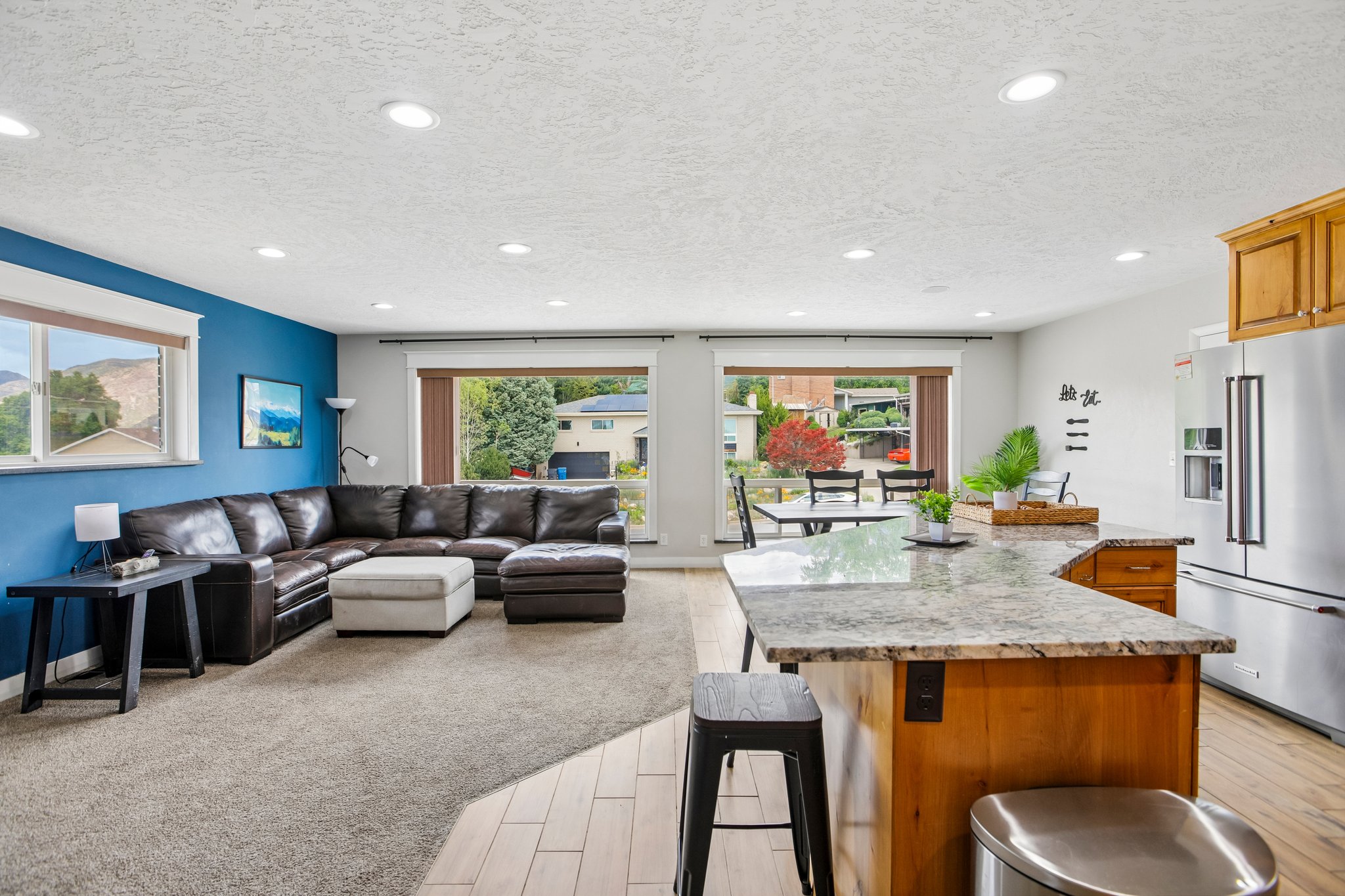 Open-concept living space featuring recessed lighting and hard-surface flooring