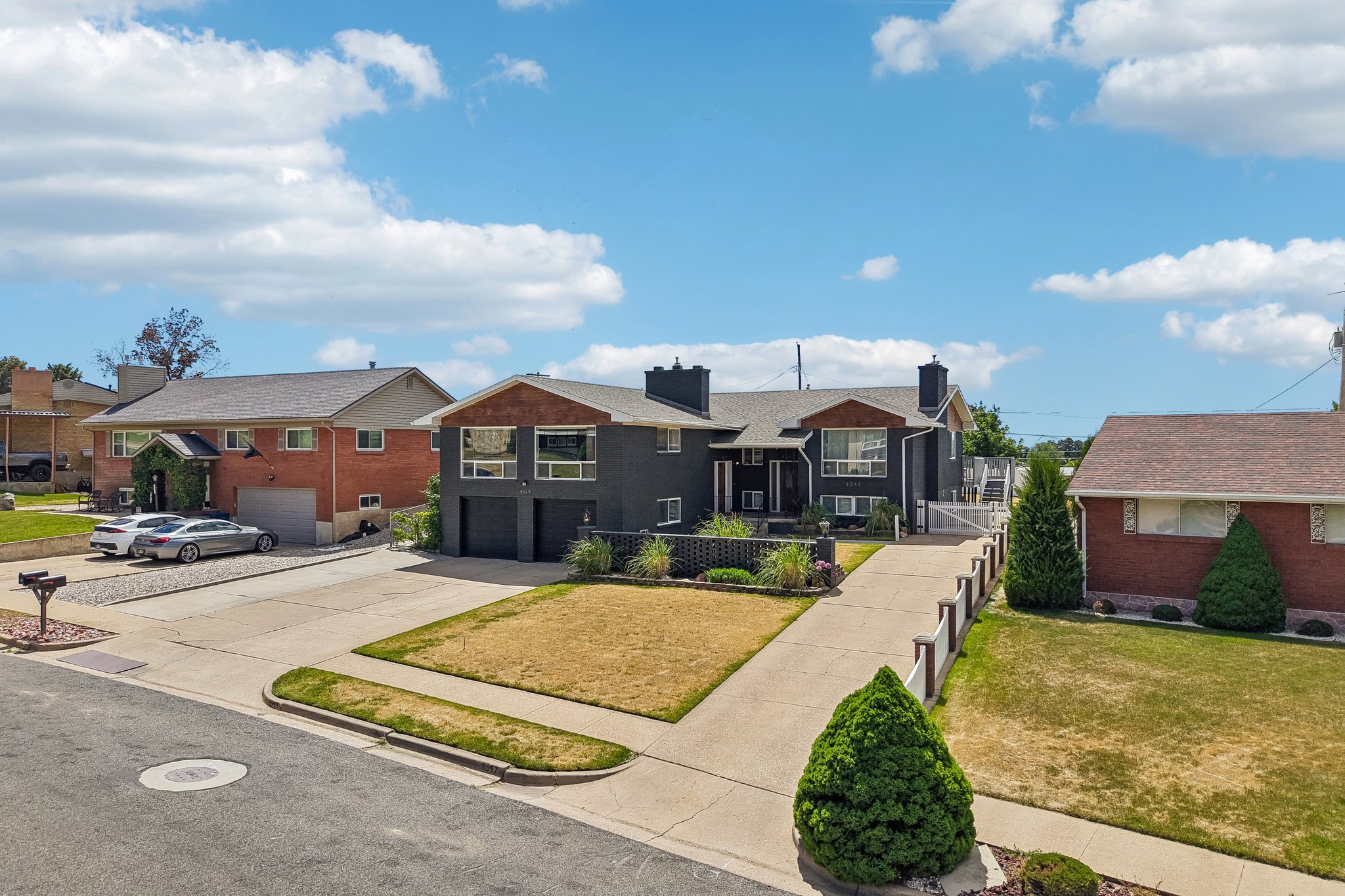 Dark-toned exterior featuring prominent architectural elements and multiple windows