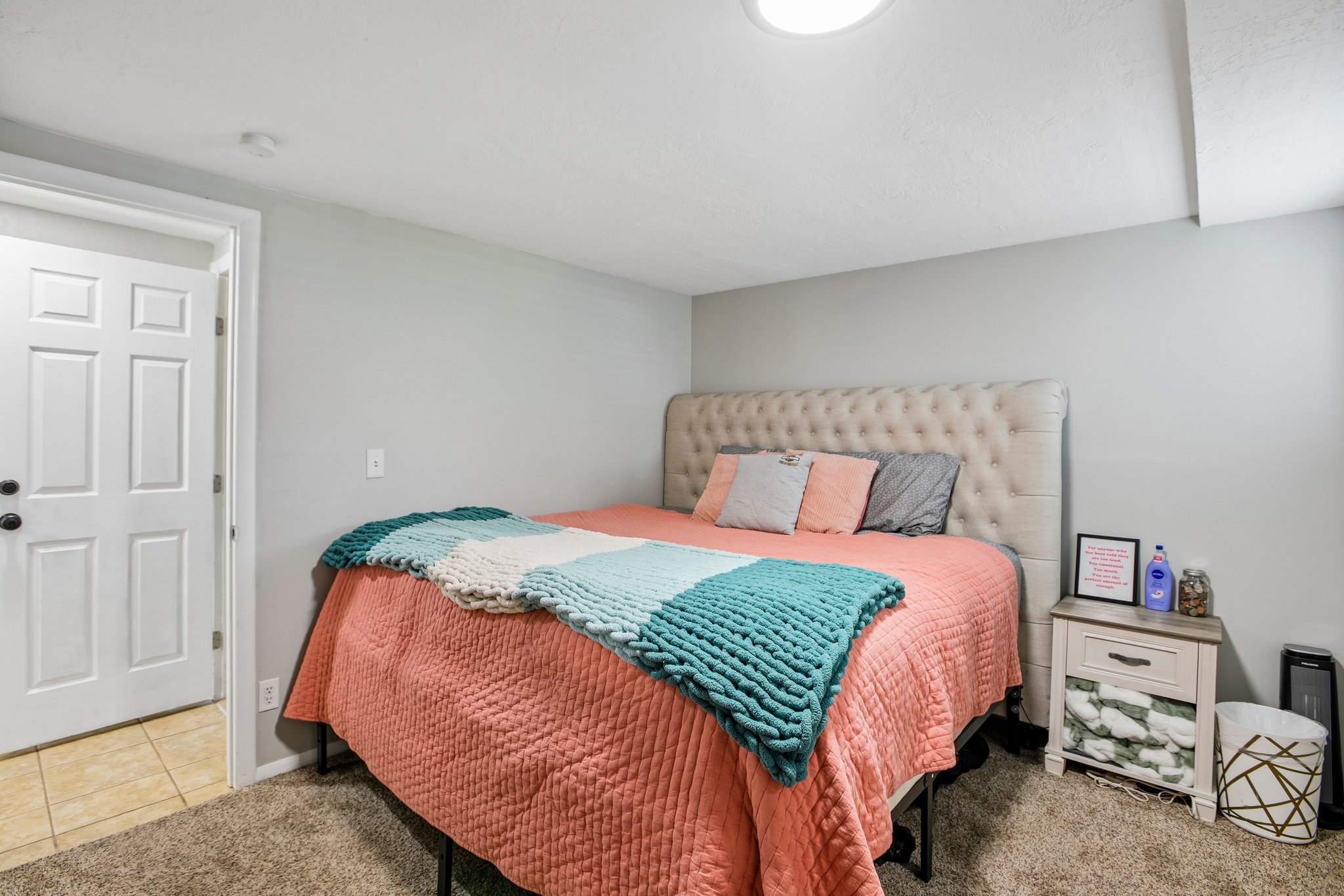 Bedroom featuring light gray walls and a neutral-toned carpet