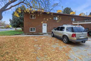 Brick exterior with white entry door and trim