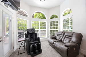 Bright interior space featuring multiple arched transom windows and white window blinds
