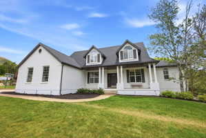 White brick exterior with a dark gray roof