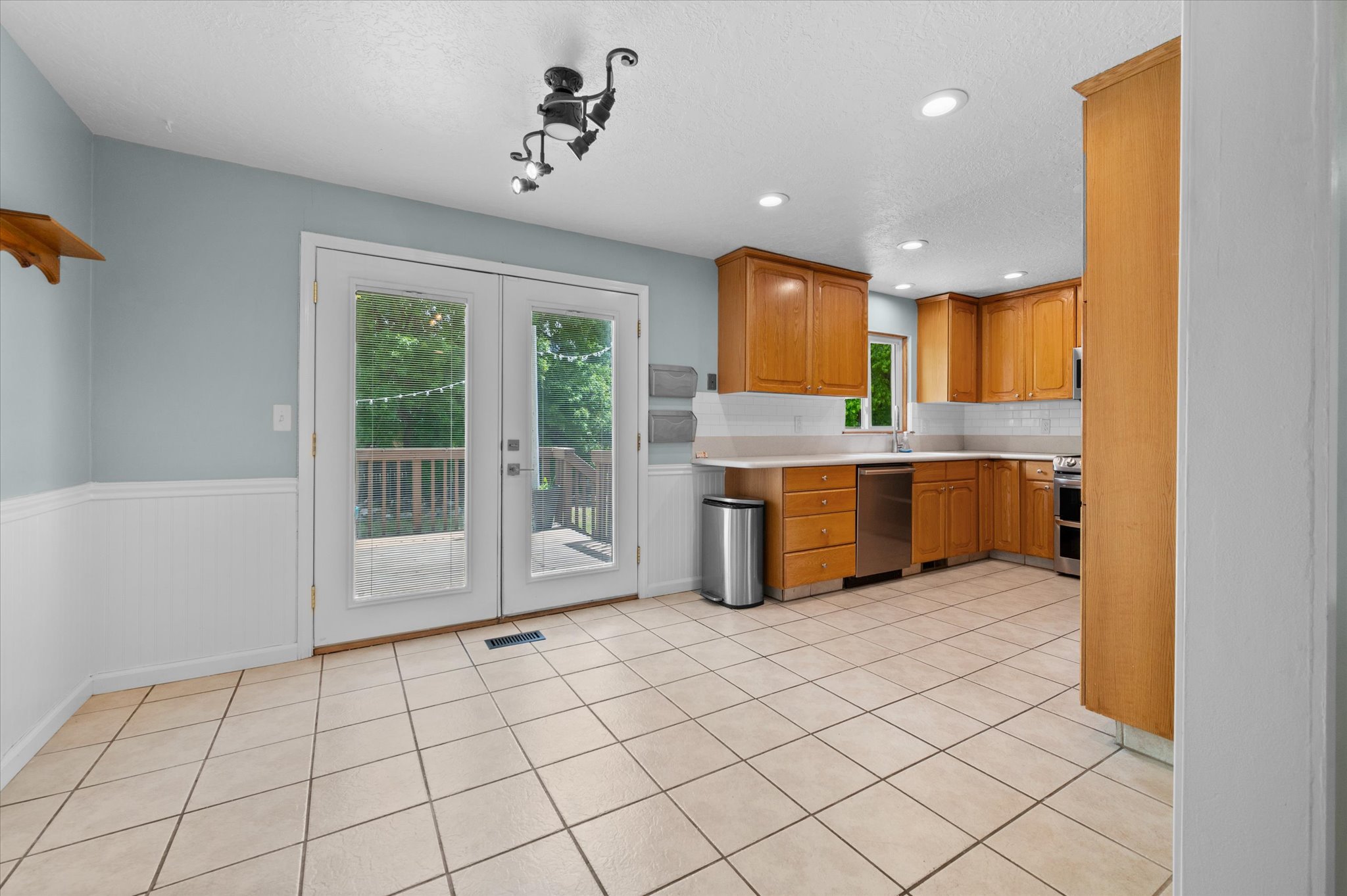 Kitchen featuring semi formal dining area, walkout to back porch, and natural lighting
