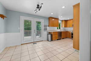 Kitchen featuring semi formal dining area, walkout to back porch, and natural lighting