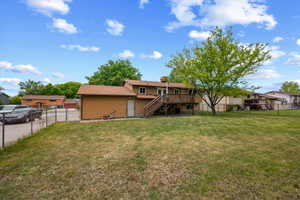Spacious backyard with a large deciduous tree