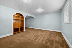Spacious family room featuring a built in entertainment center
