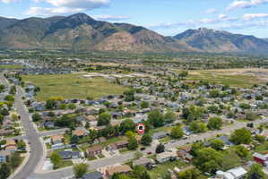 Aerial perspective showcasing a residential neighborhood with distant mountain scenery