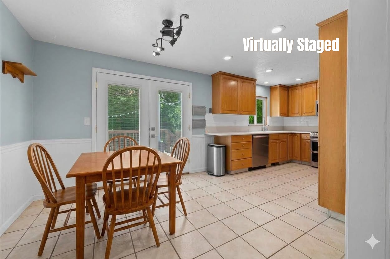 Kitchen featuring light wood cabinetry, stainless steel appliances, and tile flooring