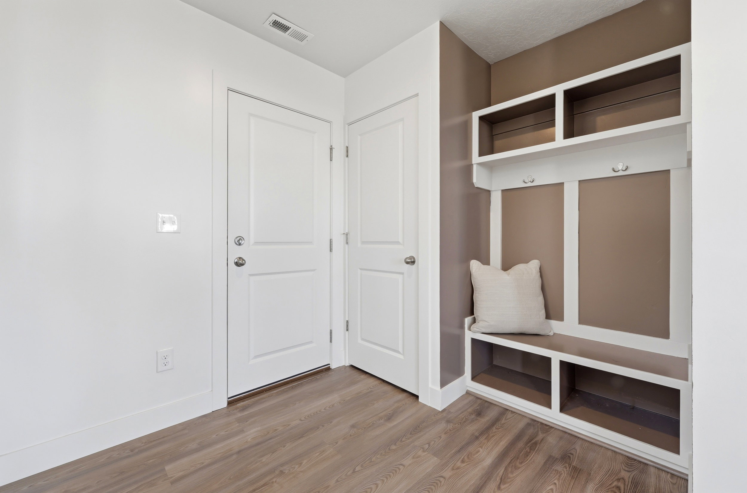 Entryway from garage with builtins