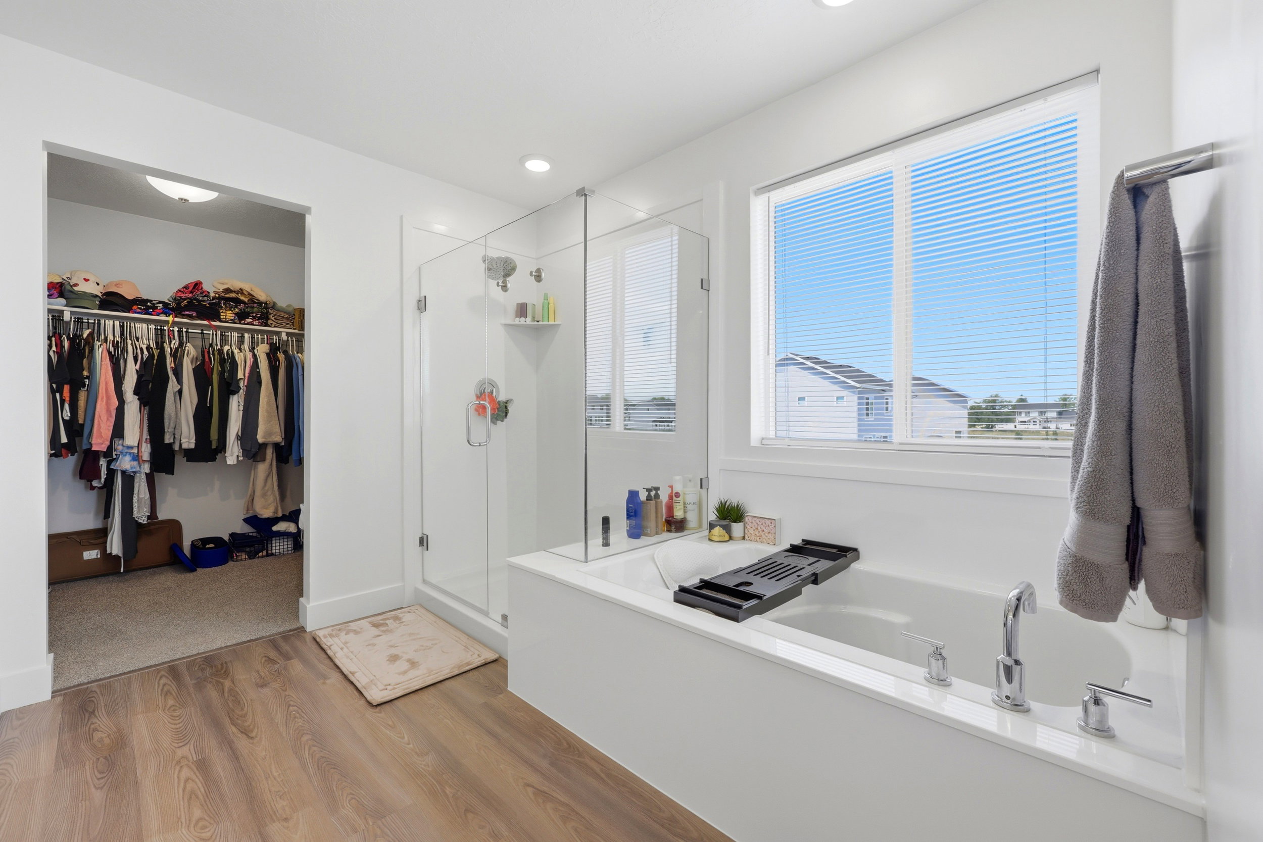 Primary ensuite bathroom with separate tub