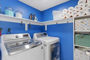 Separate laundry room with storage. Washer and dryer staying.