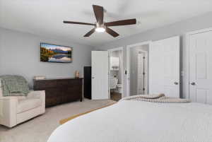 Primary Bedroom with entrance to bathroom.