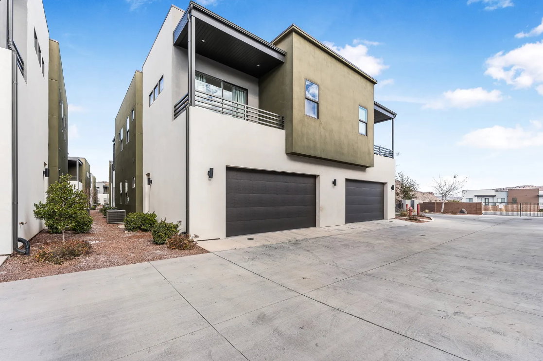 Modern stucco exterior with contrasting cream and olive tones