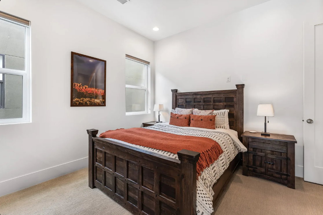 Neutral wall tones complement the light-toned carpeting and tall baseboards