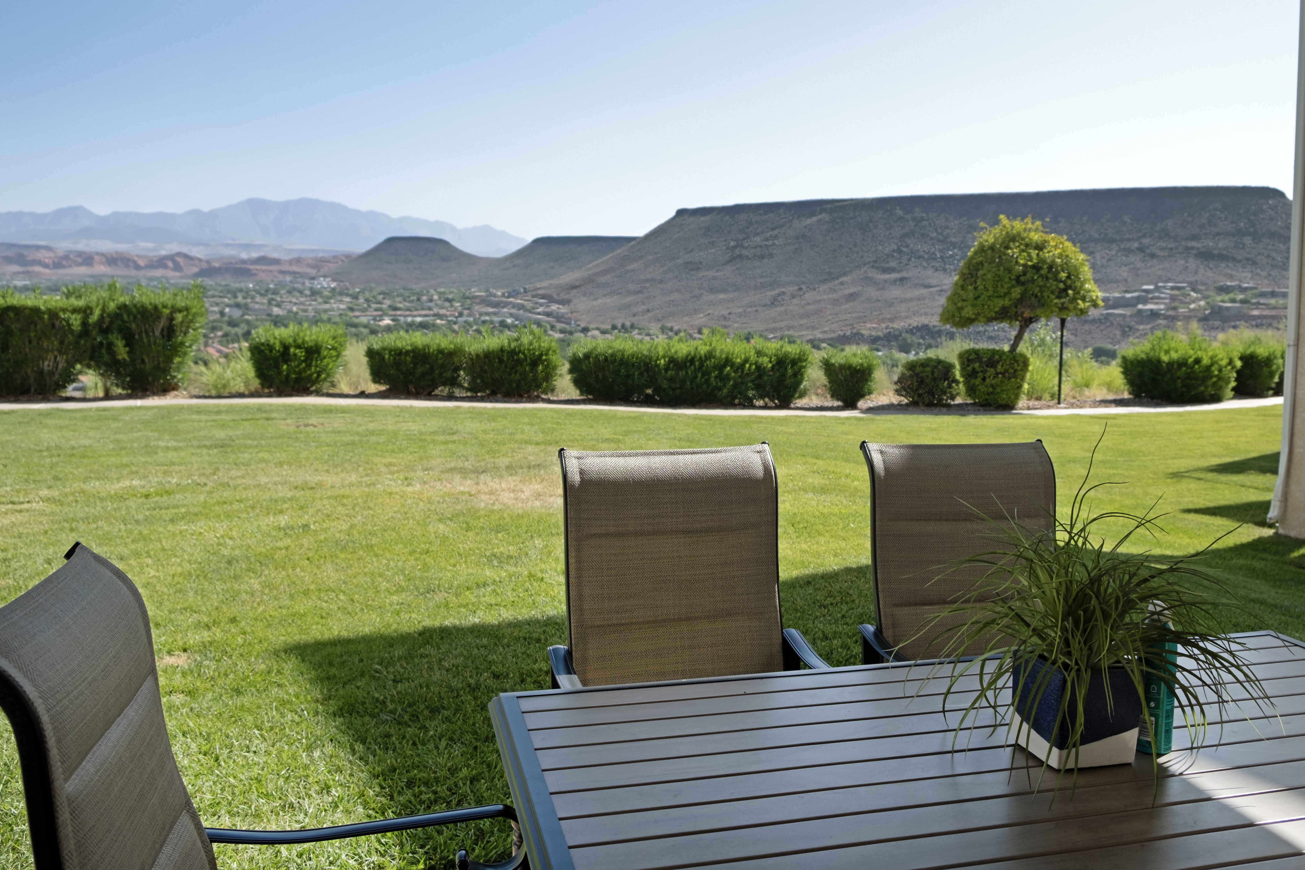 Expansive manicured lawn with low-lying perimeter shrubs