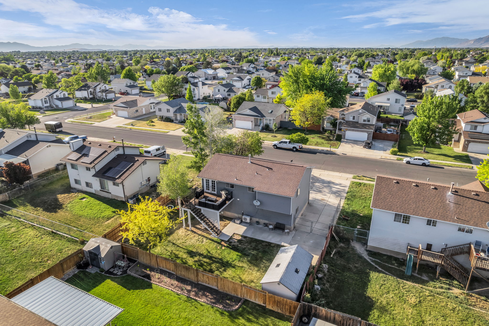 Two-story residence featuring a private backyard, composite decking, and a fenced perimeter
