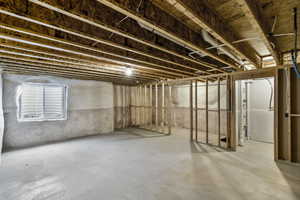 Unfinished basement with potential for another bedroom, full bathroom, and media room.