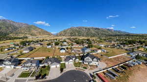 Expansive mountain range backdrop framing a residential area