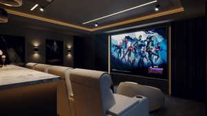 Dedicated home theater featuring a large projection screen, recessed ceiling lighting, and a built-in counter with a light-toned countertop
