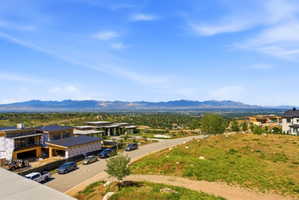 Expansive mountainous landscape with distant snow-capped peaks